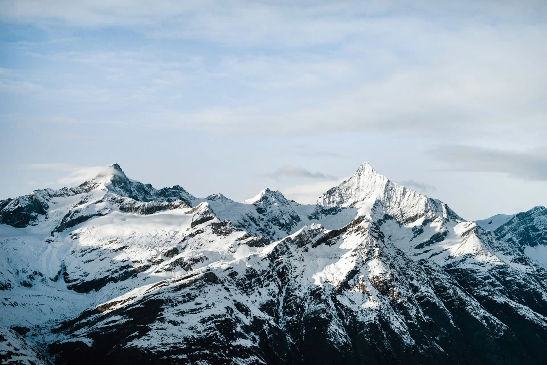 Rocky mountain ridge with snow-covered peaks